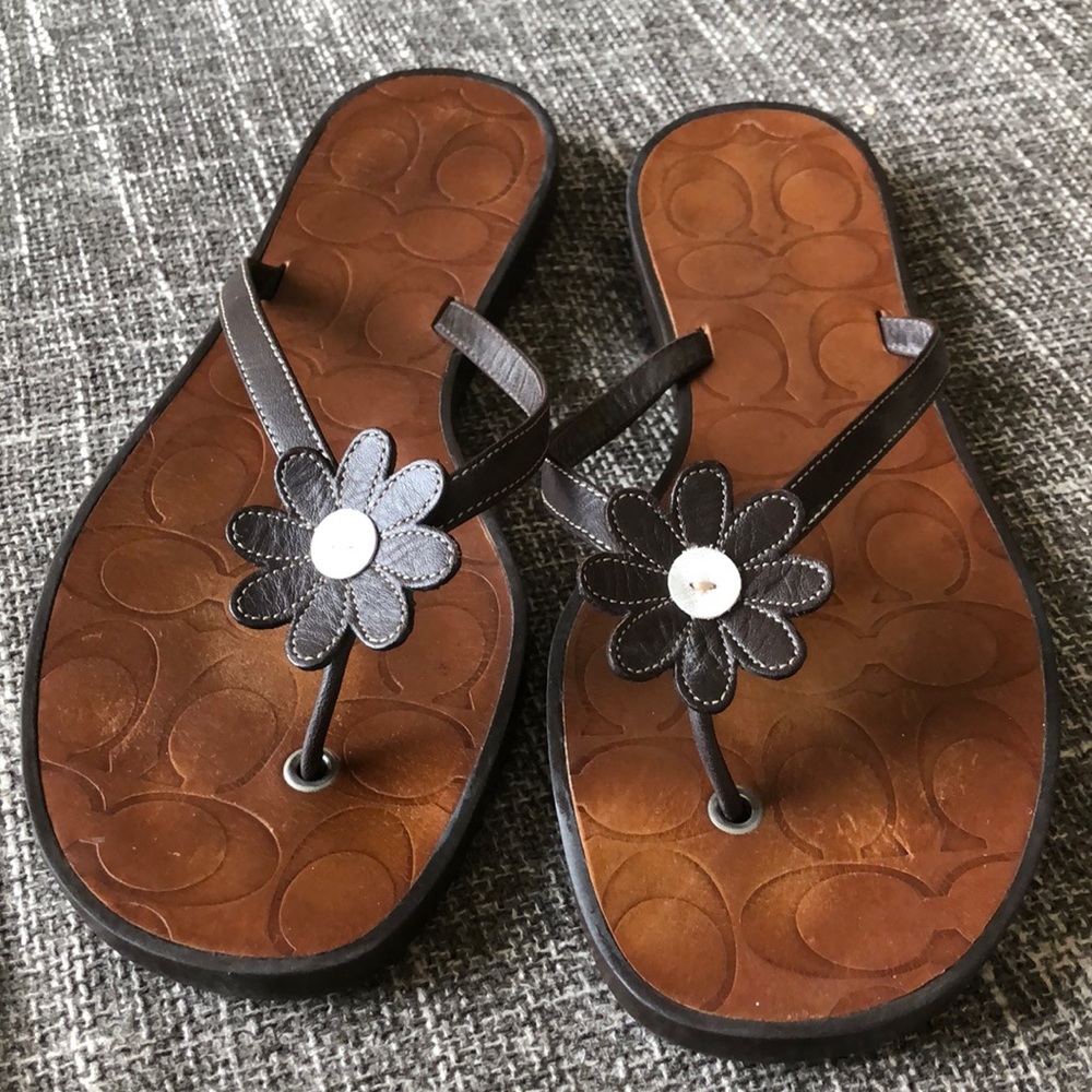 Coach leather flip flops.